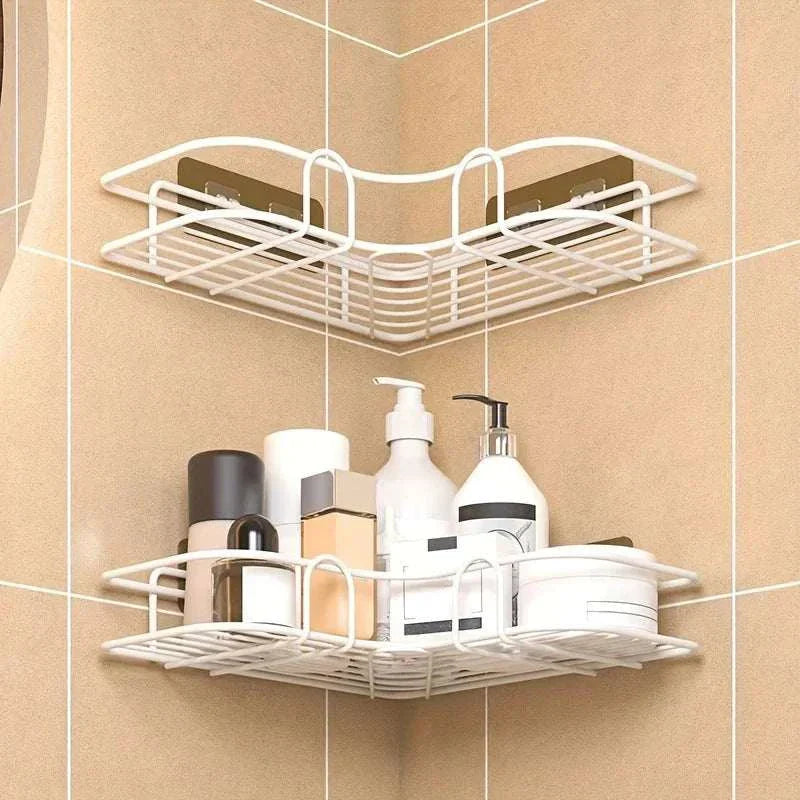 Wall mounted bathroom triangle storage rack in white, neatly organizing toiletries in a tiled bathroom corner.